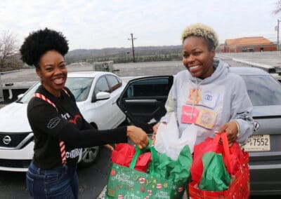united way staffer distributes gifts to family in clarksville