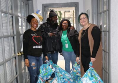 staff with volunteers at adopt a family event in clarksville