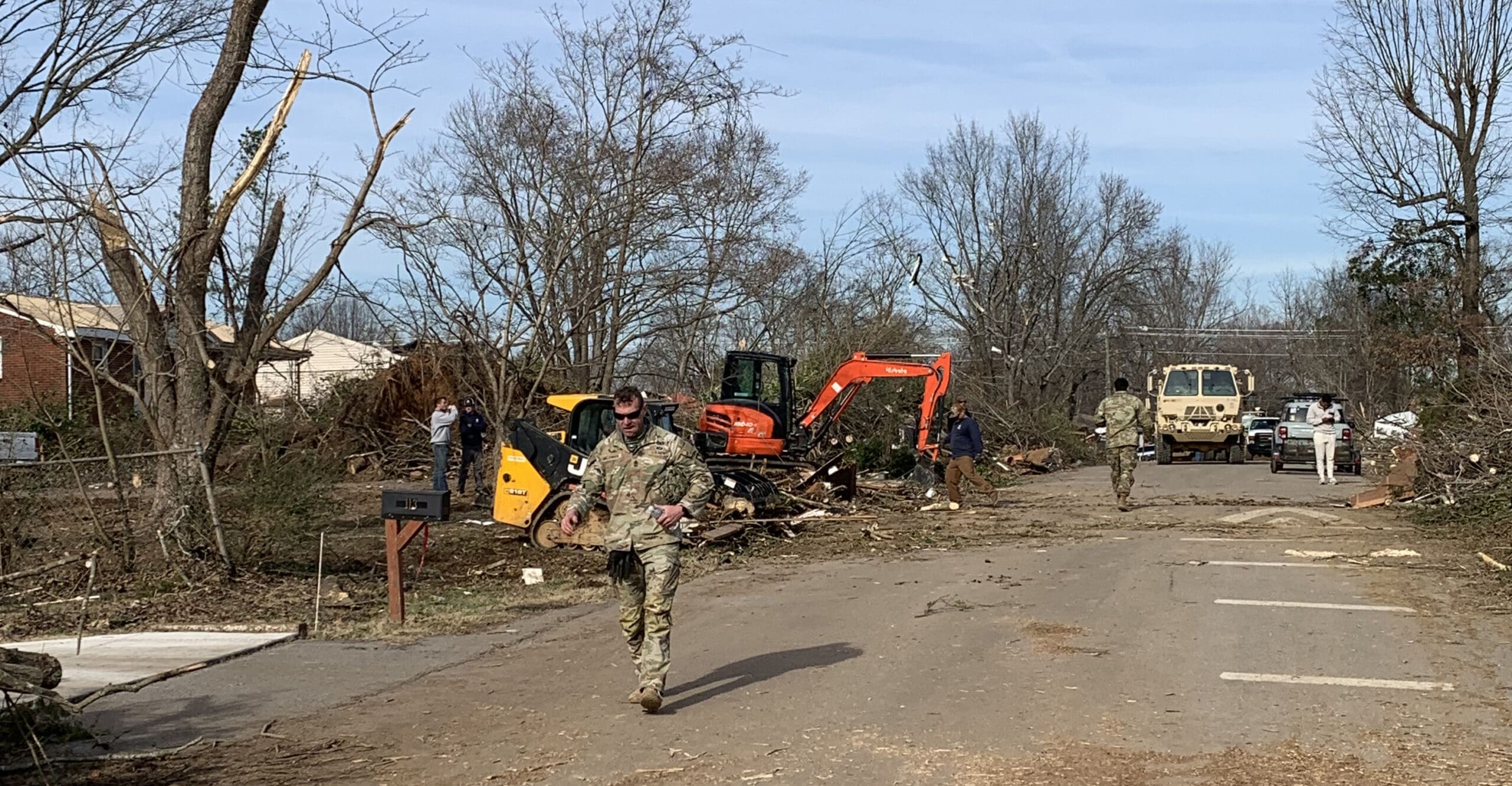 military men at tornado recovery cleanup