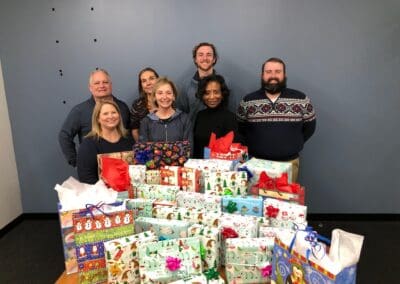 trane team members with gifts for adopt a family