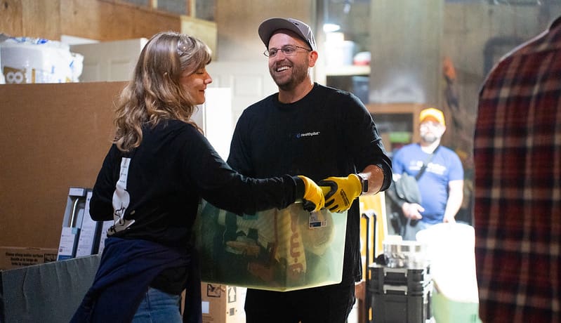 co-workers volunteering at a food bank