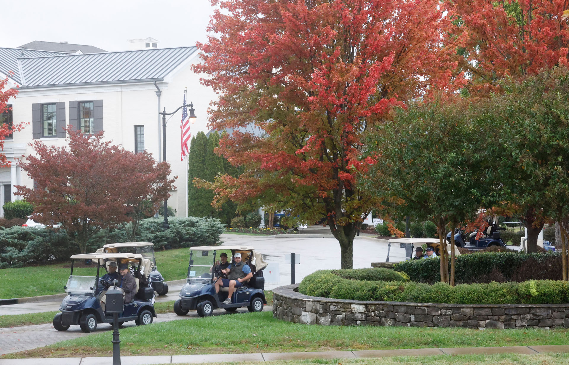 man speaking with microphone at golf scramble
