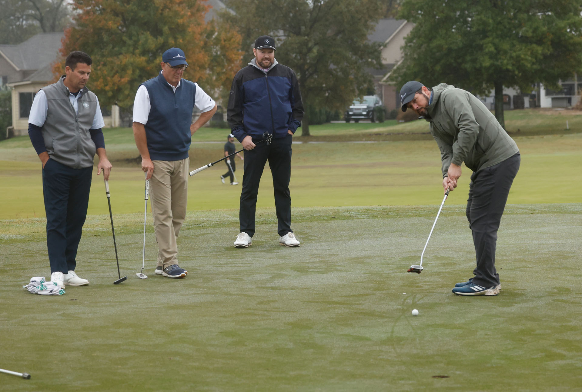 golfers executing a shot